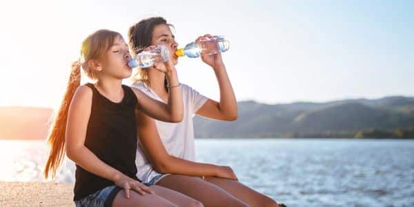 Children enjoying better tasting water at home as part of healthy daily routines