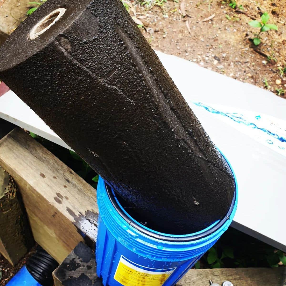 Dirty used filter showing what a whole home water filtration system can catch