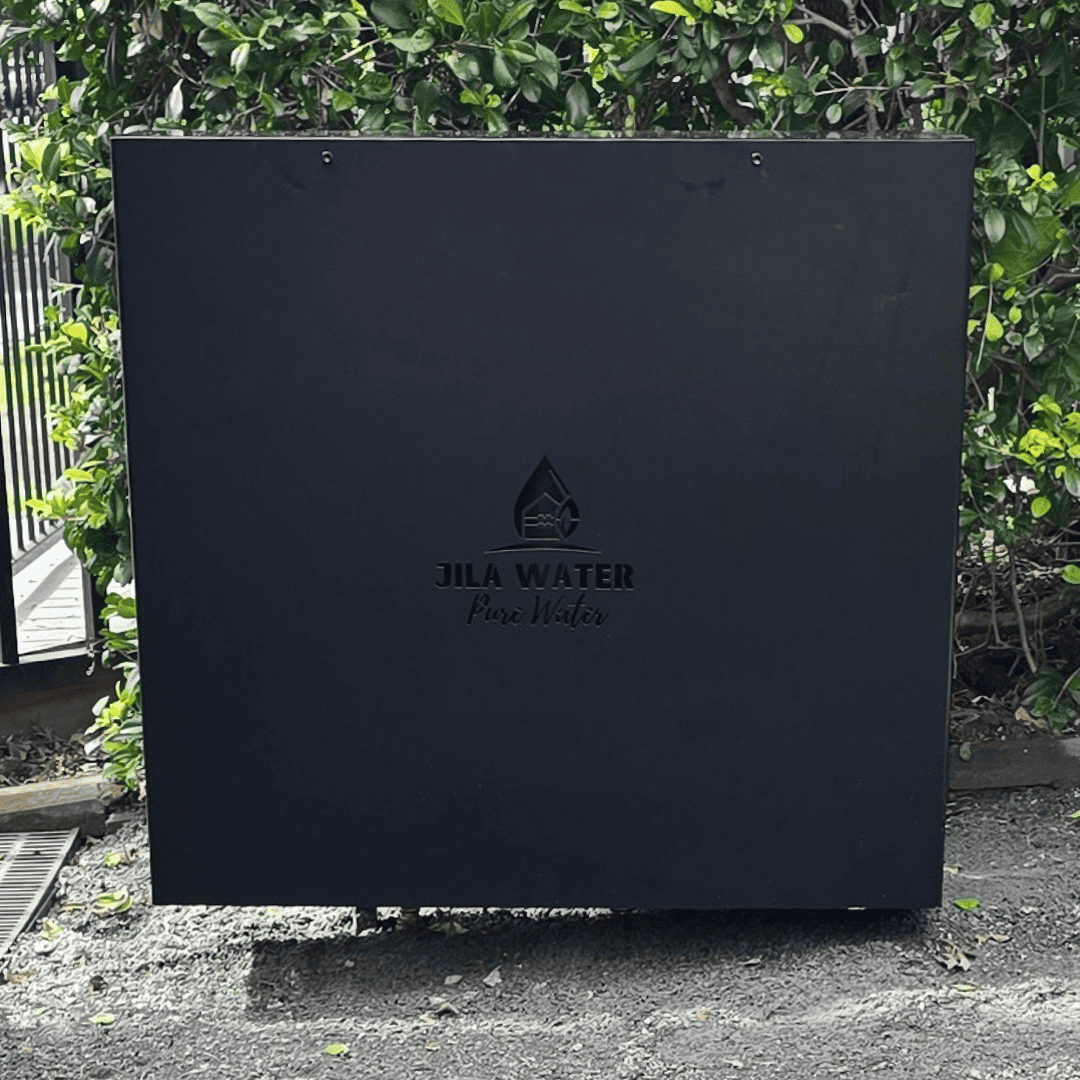 Black Jila Water whole home filtration system installed outdoors