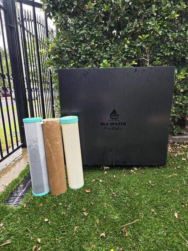 Used whole home water filter showing sediment captured from Brisbane household water