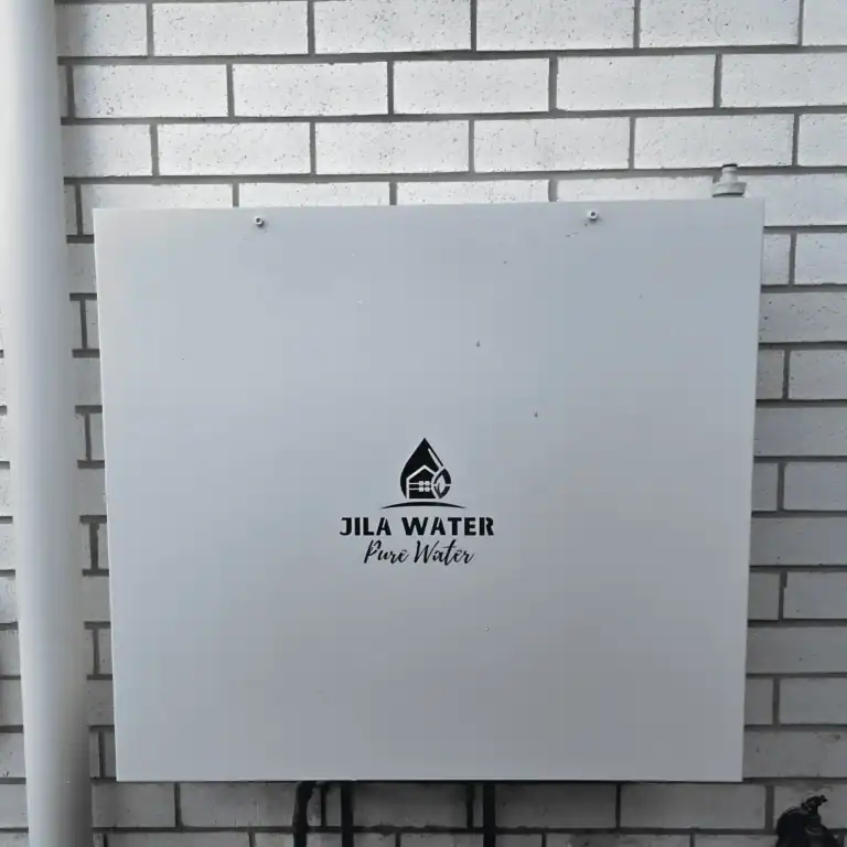 Surfmist off-white Jila Water whole home water filtration system on a white brick Brisbane home